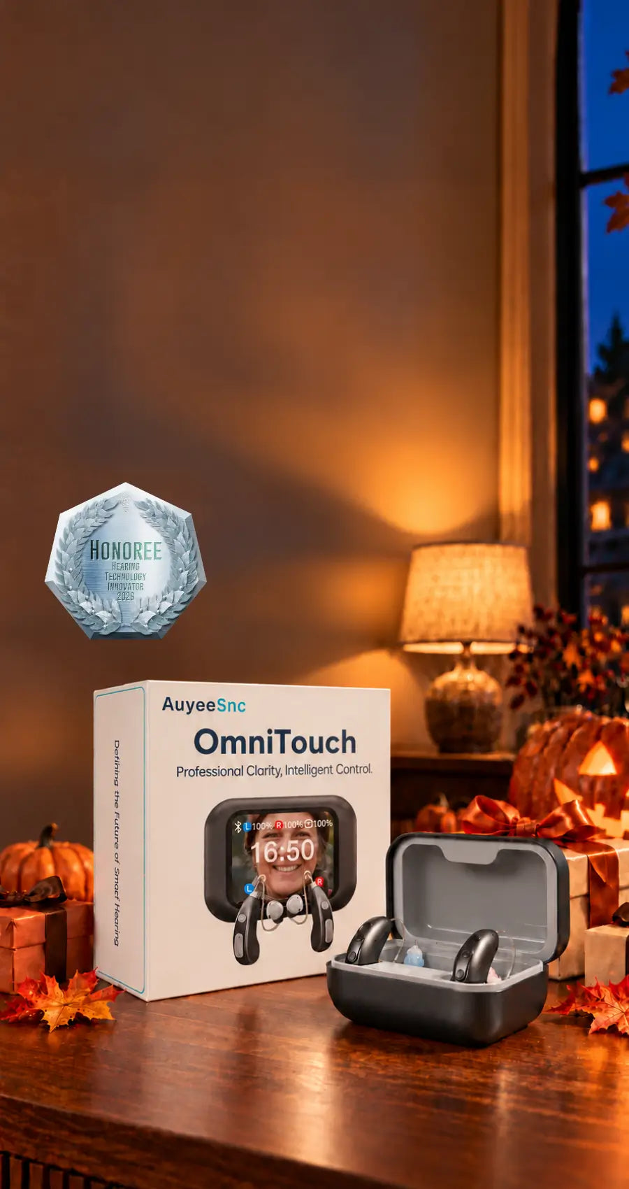 AuyeeSnc OmniTouch hearing aids and charging case with Halloween pumpkins, gifts, and a 2026 Hearing Technology Innovator honoree badge.
